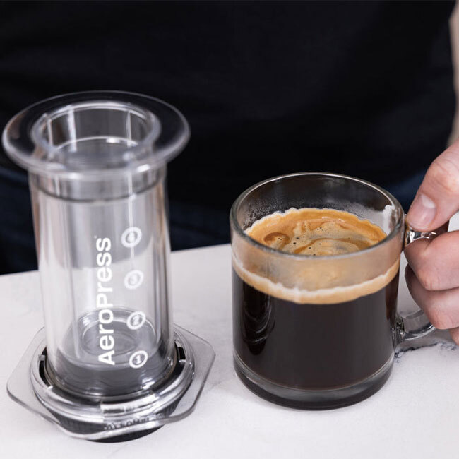 AeroPress Coffee Press | Clear with cup of java