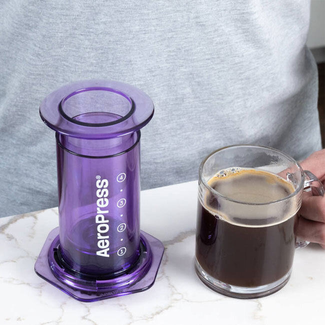 AeroPress Clear Colors Coffee Press | Purple with cup of java