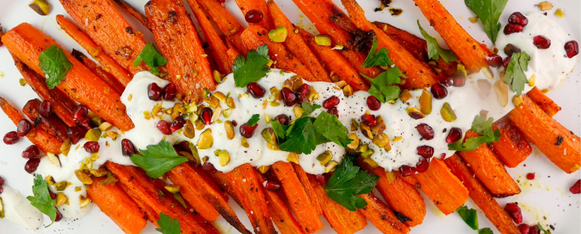 Roasted Carrots with Pistachios, Pomegranate, Parsley, and a Spicy Crema