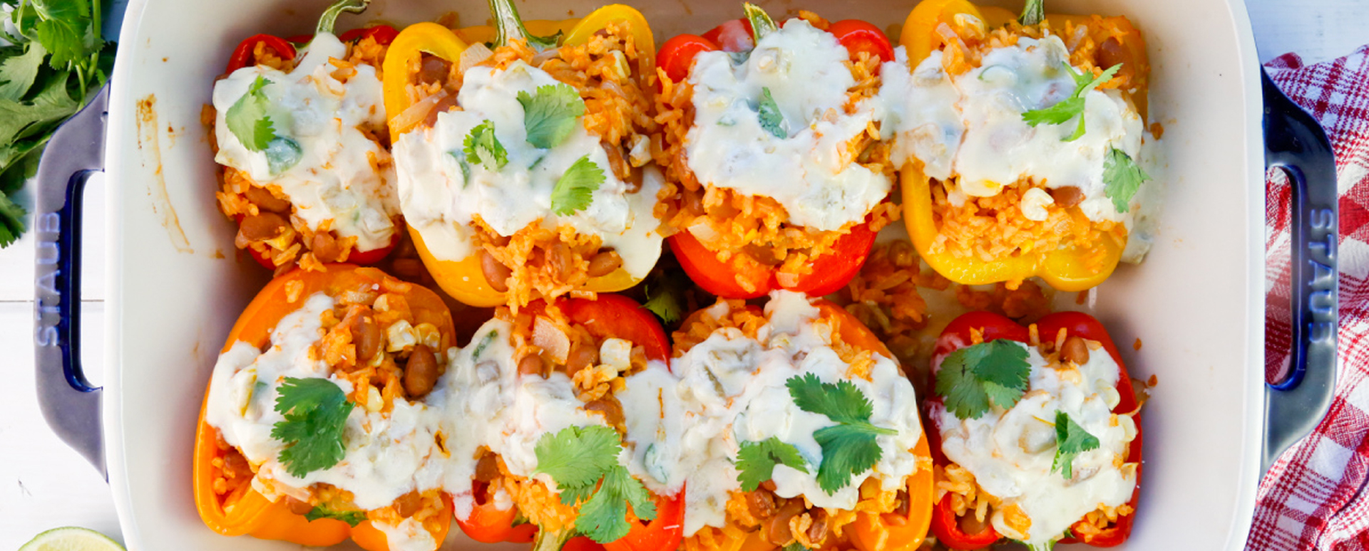 Rice and Bean Stuffed Bell Peppers with Green Chile Queso