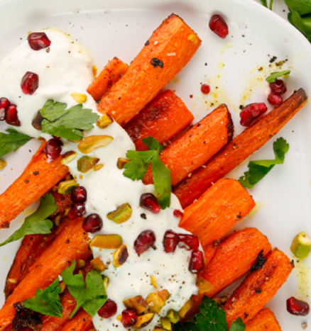 Roasted Carrots with Pistachios, Pomegranate, Parsley, and a Spicy Crema